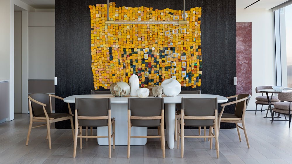 Residence 61B dining room with colorful art installation